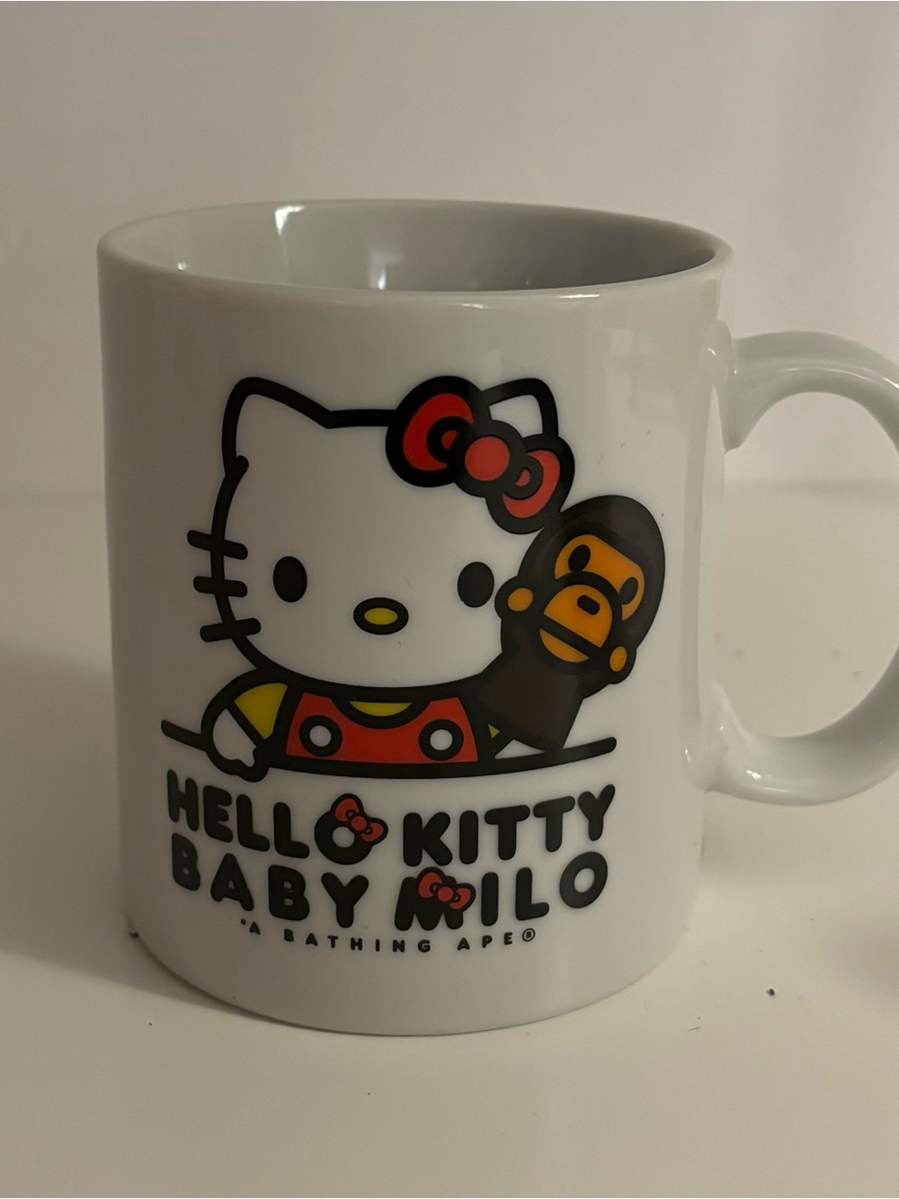 Sanrio Hello Kitty & Baby Milo White Mug with Red and Yellow Accents
